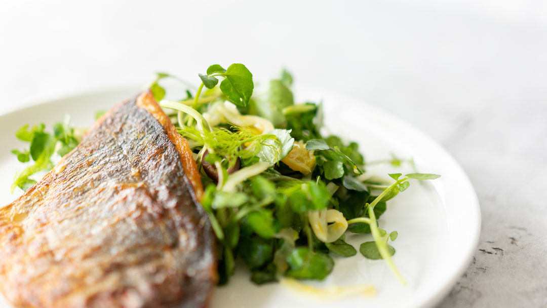 Cooked fish and watercress